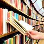 Reading,A,Book,In,The,Library